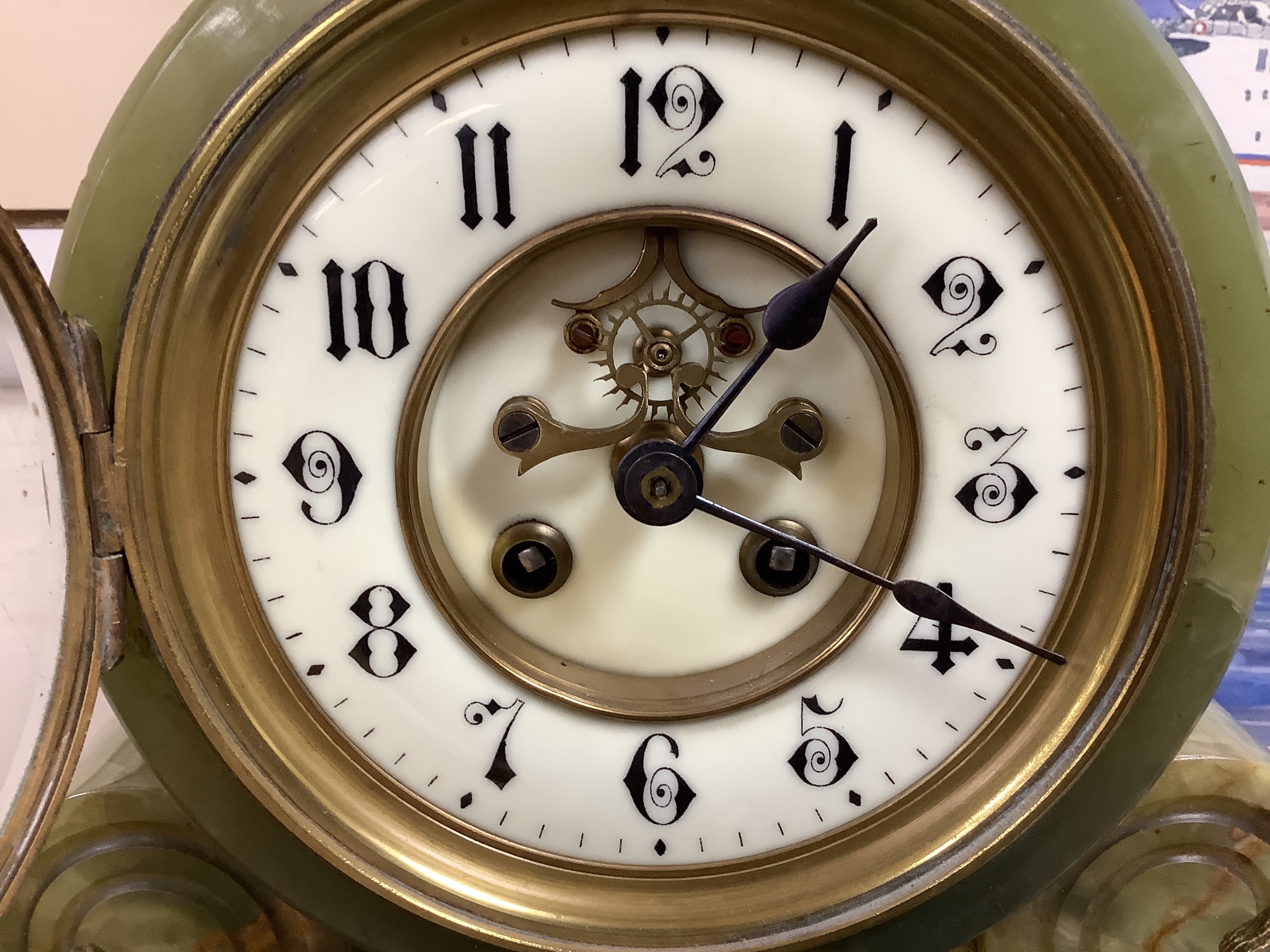 A gilt metal and onyx mantel clock garniture, height 47cm